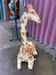 Small sitting giraffe figure / statue suitable indoors or outdoors