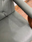Vintage style armchair in light blue-grey leather