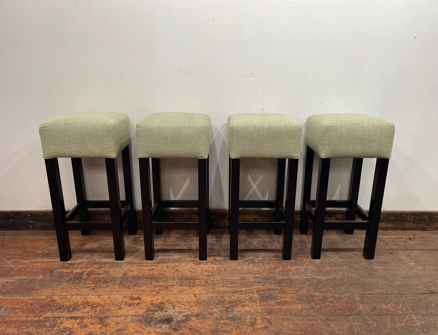 Set of 4 matching bar stools with light fabric seats