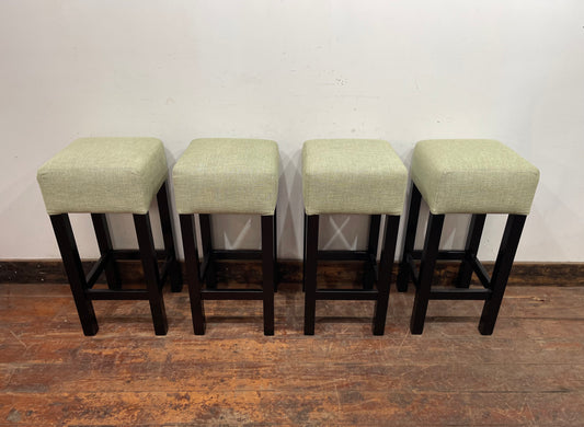 Set of 4 matching bar stools with light fabric seats