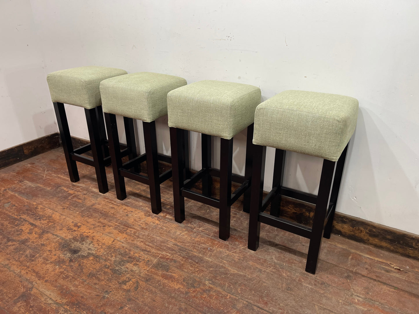 Set of 4 matching bar stools with light fabric seats