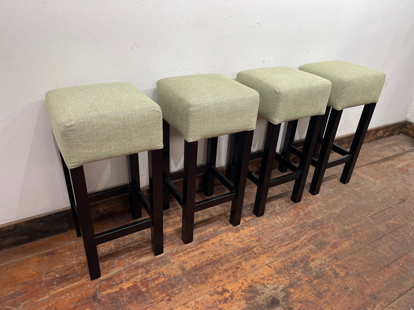 Set of 4 matching bar stools with light fabric seats