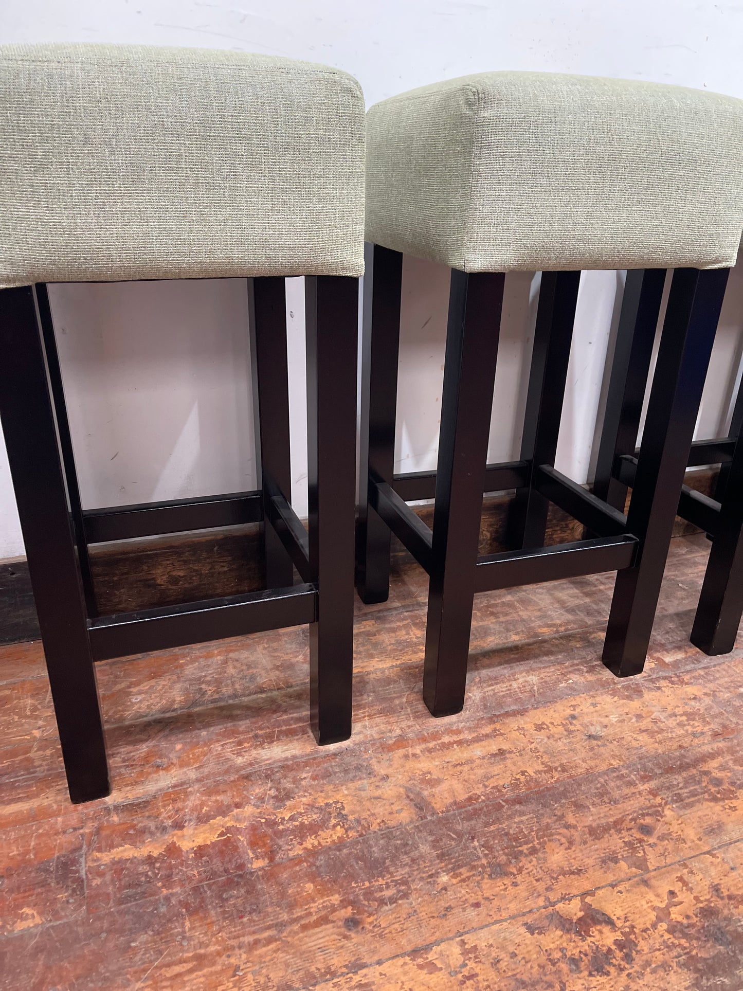 Set of 4 matching bar stools with light fabric seats