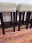 Set of 4 matching bar stools with light fabric seats