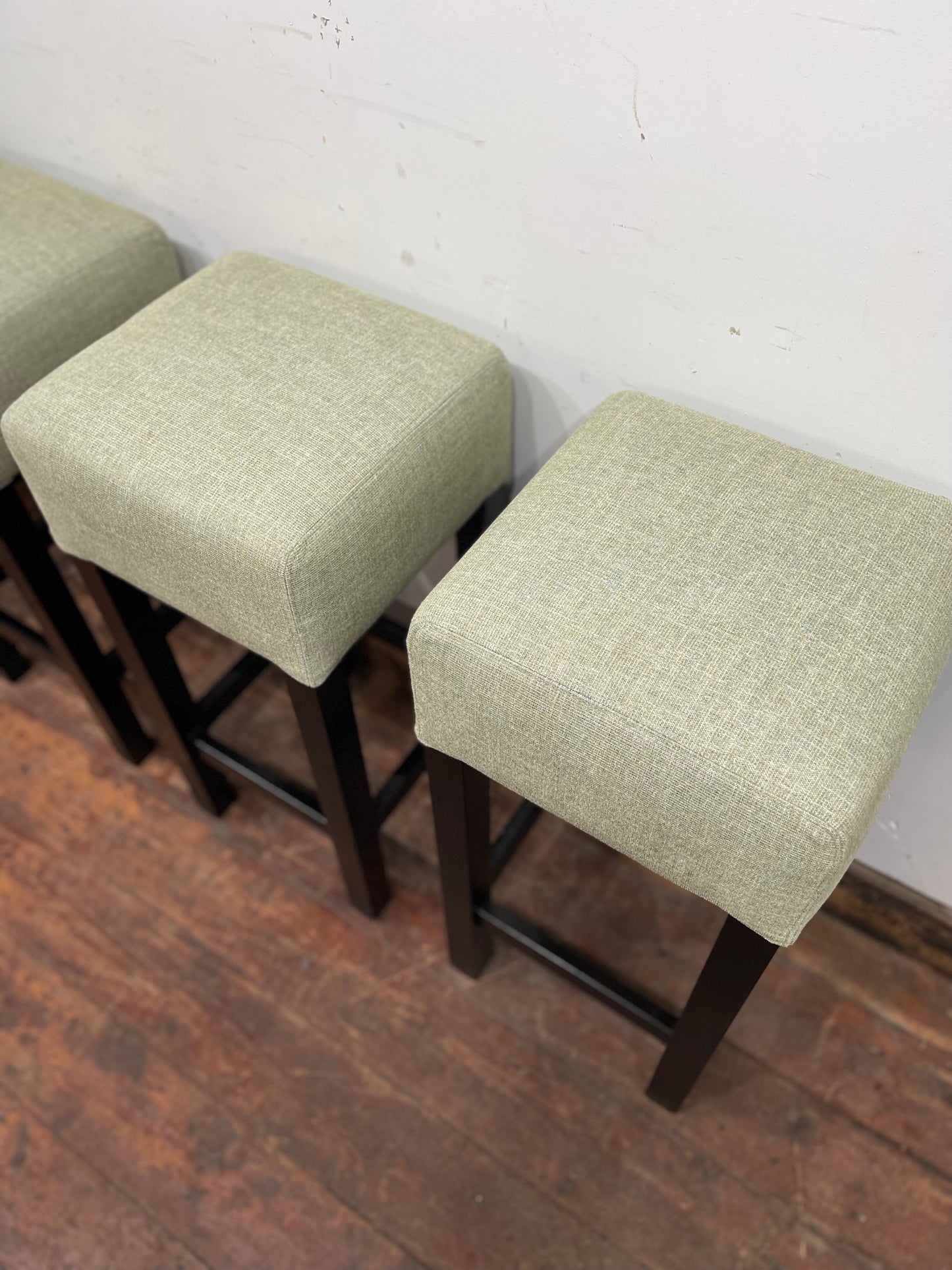 Set of 4 matching bar stools with light fabric seats