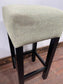 Set of 4 matching bar stools with light fabric seats