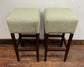 Pair of matching bar stools with light fabric seats