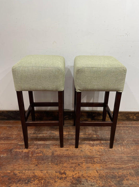 Pair of matching bar stools with light fabric seats