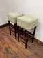 Pair of matching bar stools with light fabric seats