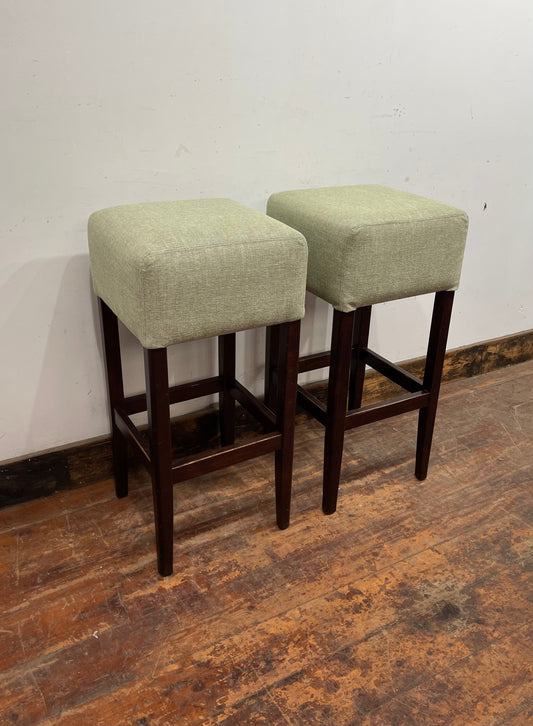 Pair of matching bar stools with light fabric seats
