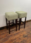 Pair of matching bar stools with light fabric seats