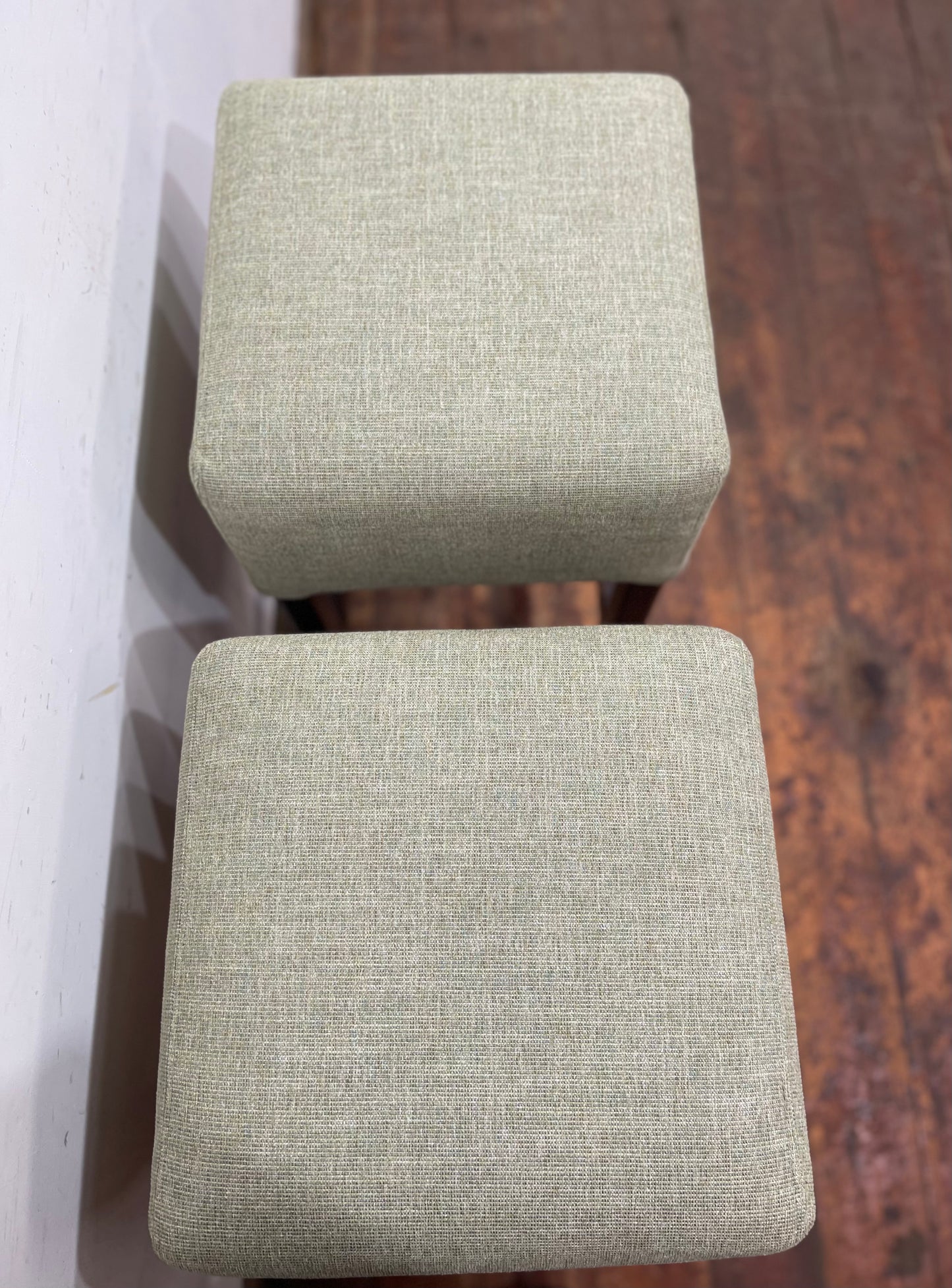Pair of matching bar stools with light fabric seats