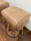 Pair of pommel stools with light tan leather seats