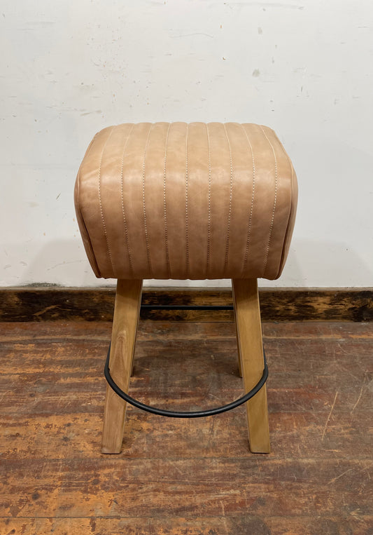 Pommel stool with light tan leather seat