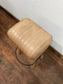 Pommel stool with light tan leather seat