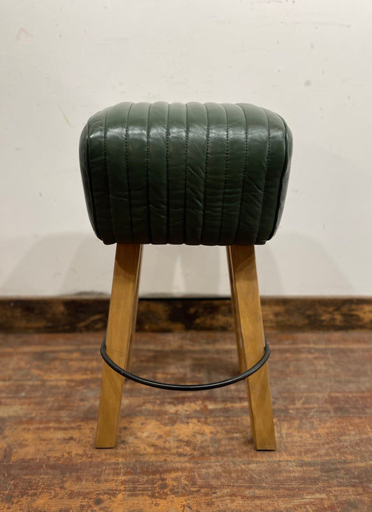 Pommel stool with green leather seat