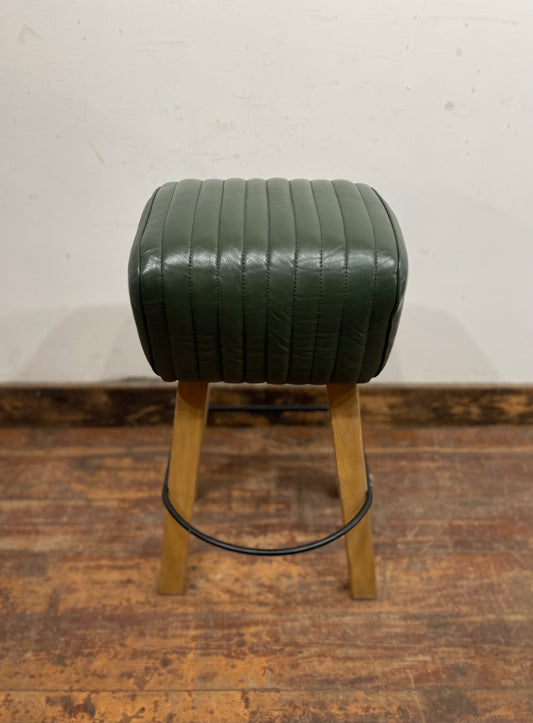 Pommel stool with green leather seat