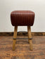 Pommel stool with dark tan / brown leather seat
