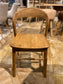 Pair of dining chairs in light wood tone