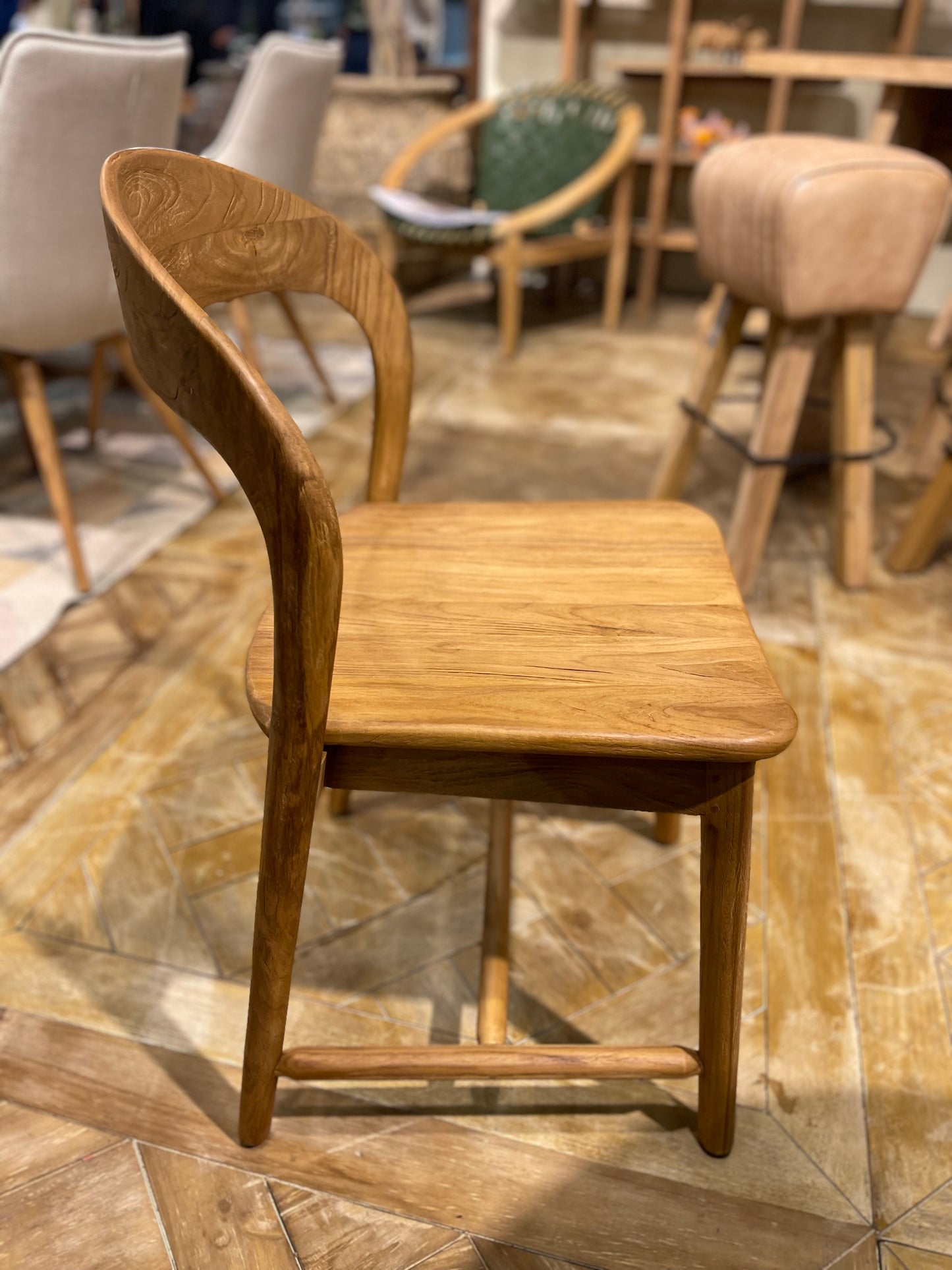 Pair of dining chairs in light wood tone