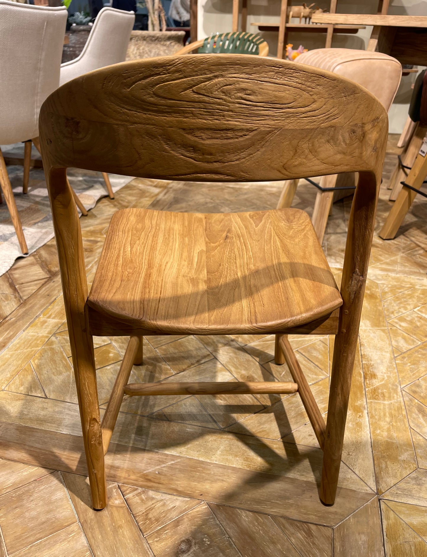 Pair of dining chairs in light wood tone