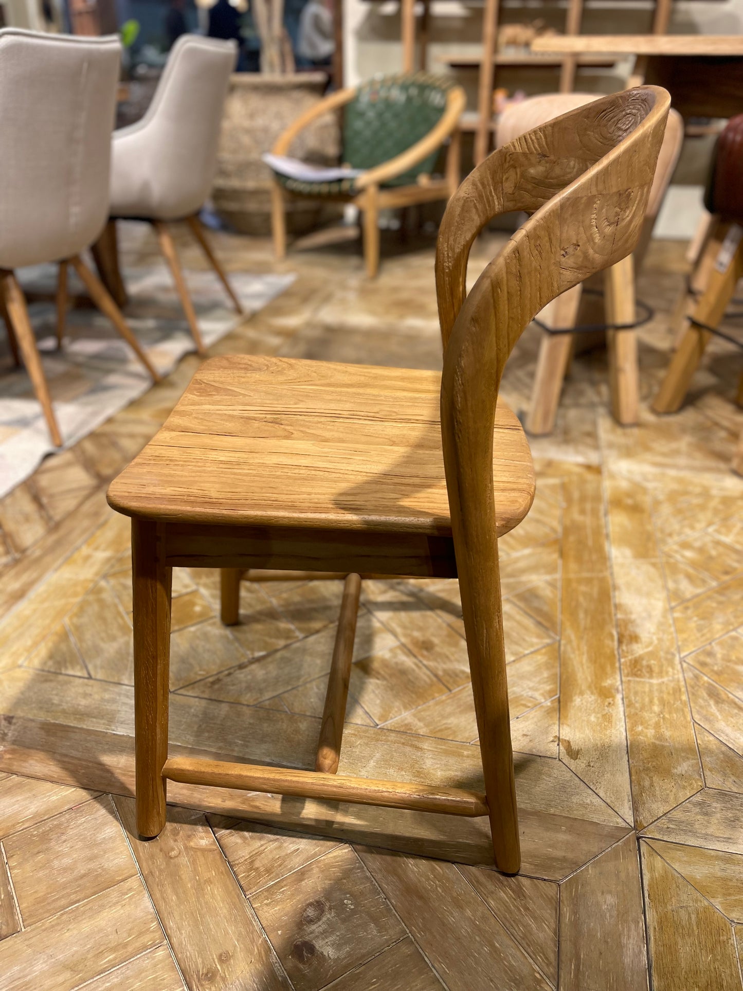 Pair of dining chairs in light wood tone