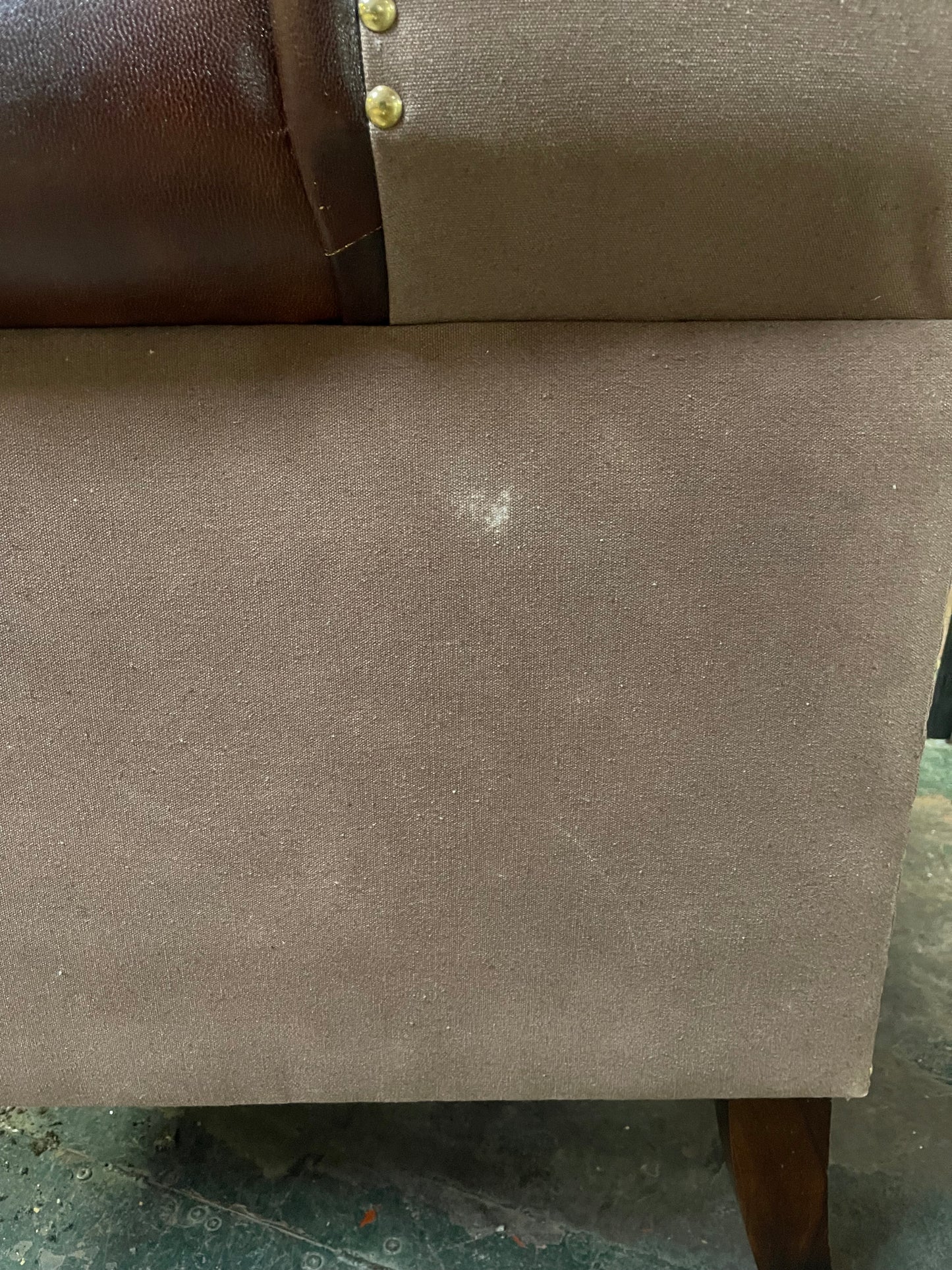 Chestnut brown leather armchair with button back