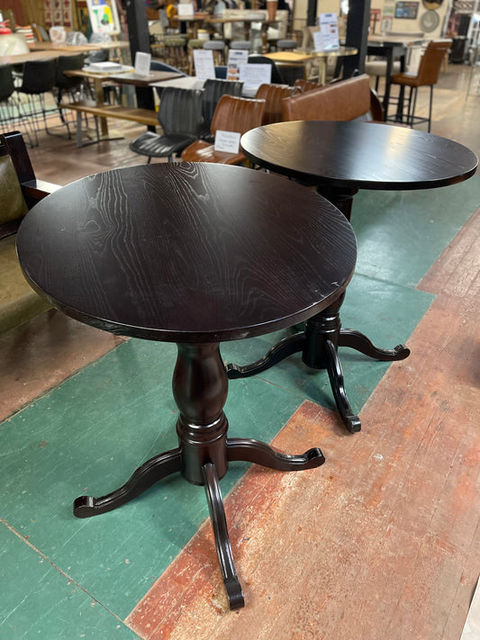 Matching pair of tall poseur tables in dark wood for pub / bar