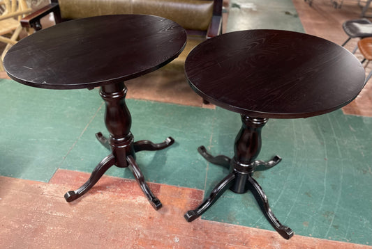 Matching pair of tall poseur tables in dark wood for pub / bar