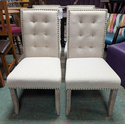 Set of Four Off-White Fabric Upholstered Dining Chairs / Brass Studs