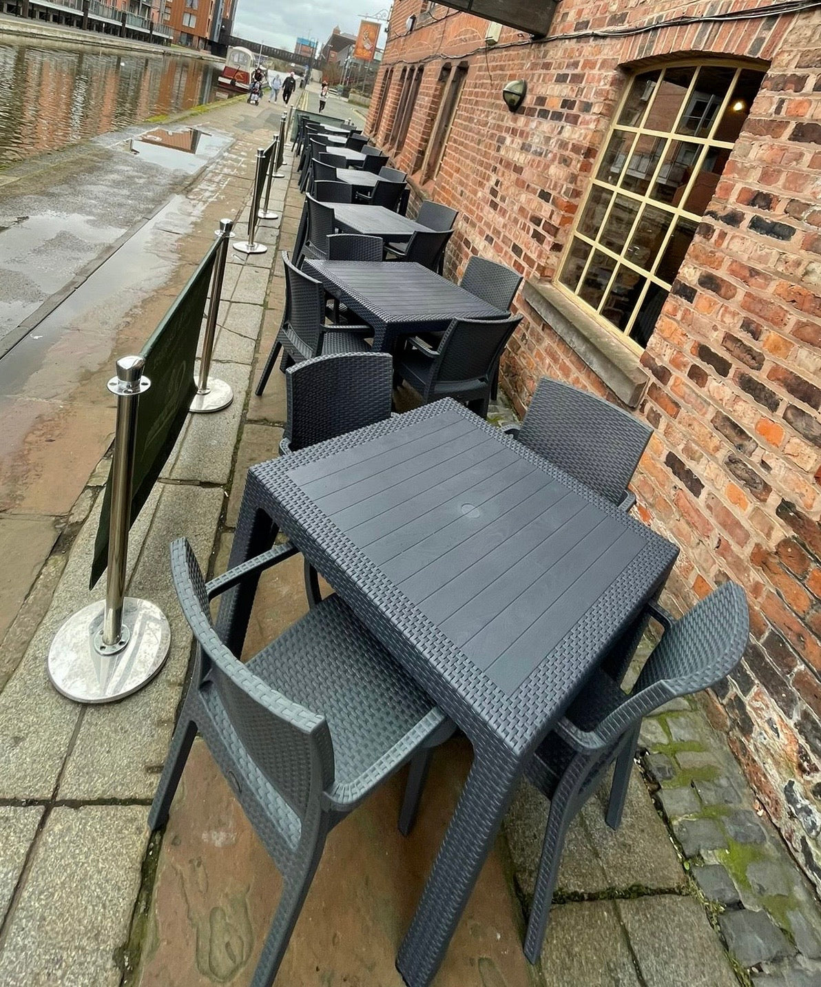 Pair of stackable outdoor pub / bar / cafe chairs in grey (no armrests)