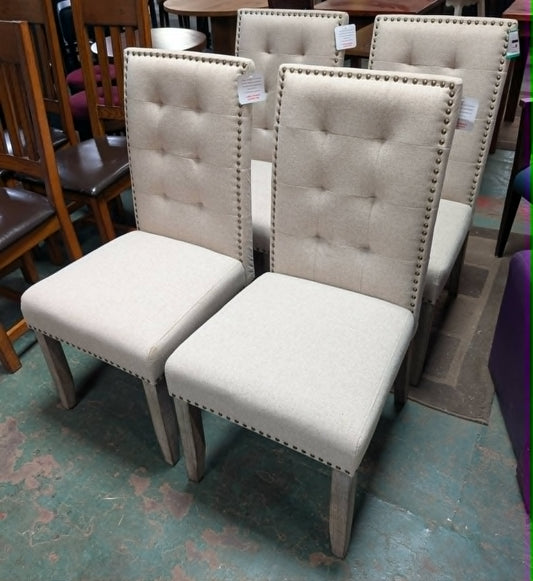 Set of Four Off-White Fabric Upholstered Dining Chairs / Brass Studs