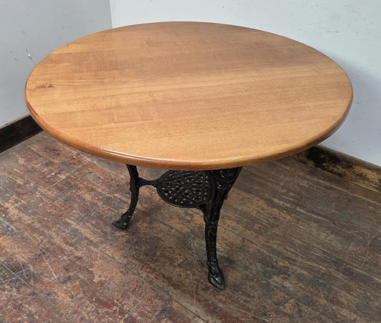 Medium Round Dining Table with Ornate Cast Iron Base and Light Wood Top